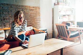 Woman in glasses working on computer